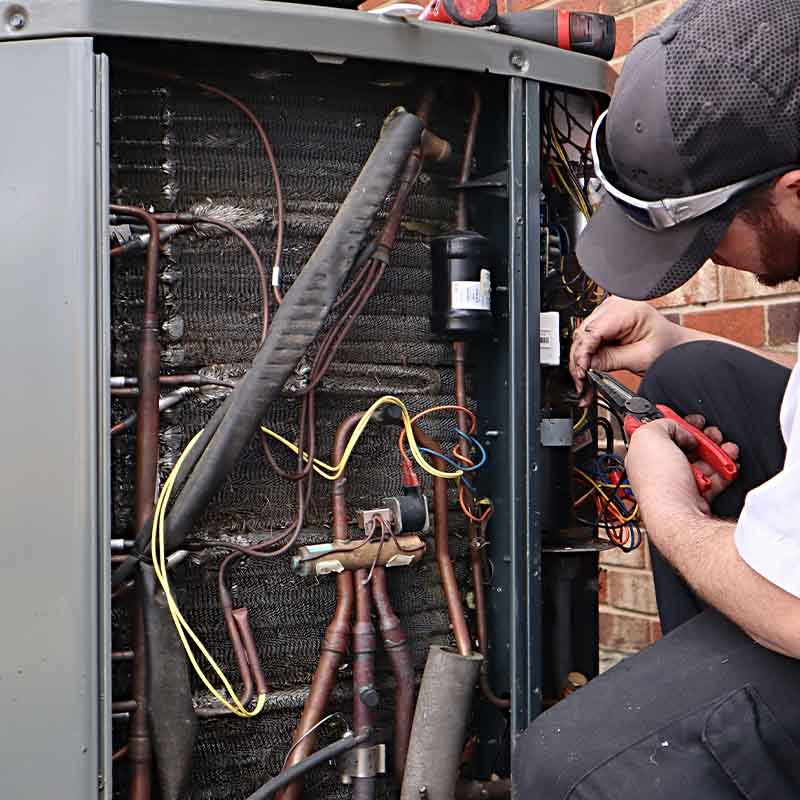 Thompsons-Station-TN-Specialty-heating-and-cooling-service-repair-being-done-on-a-heat-pump-hvac-system